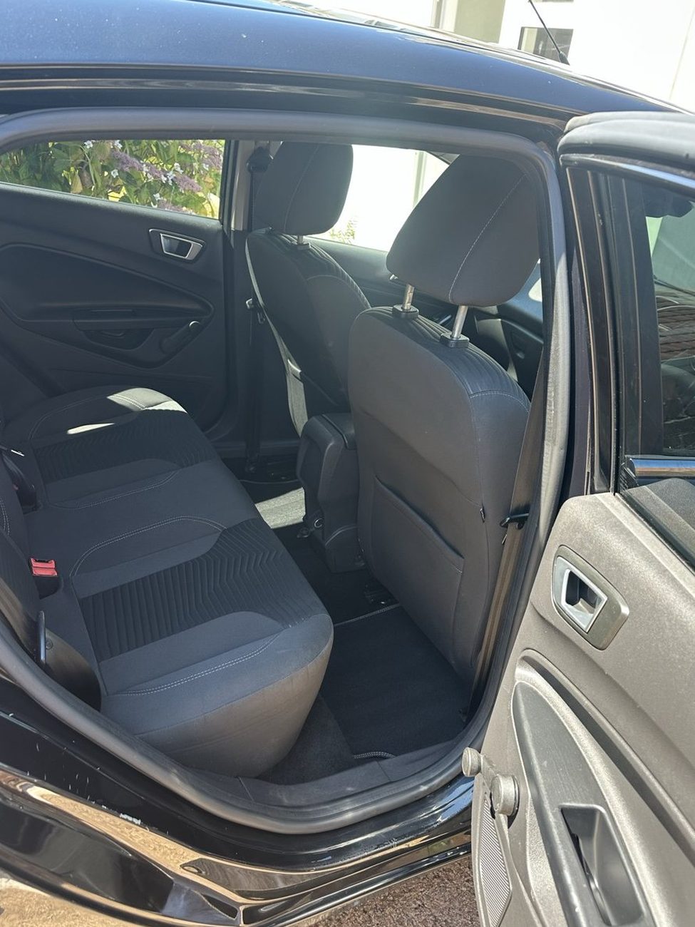Black Ford Fiesta rear seats after a deep clean