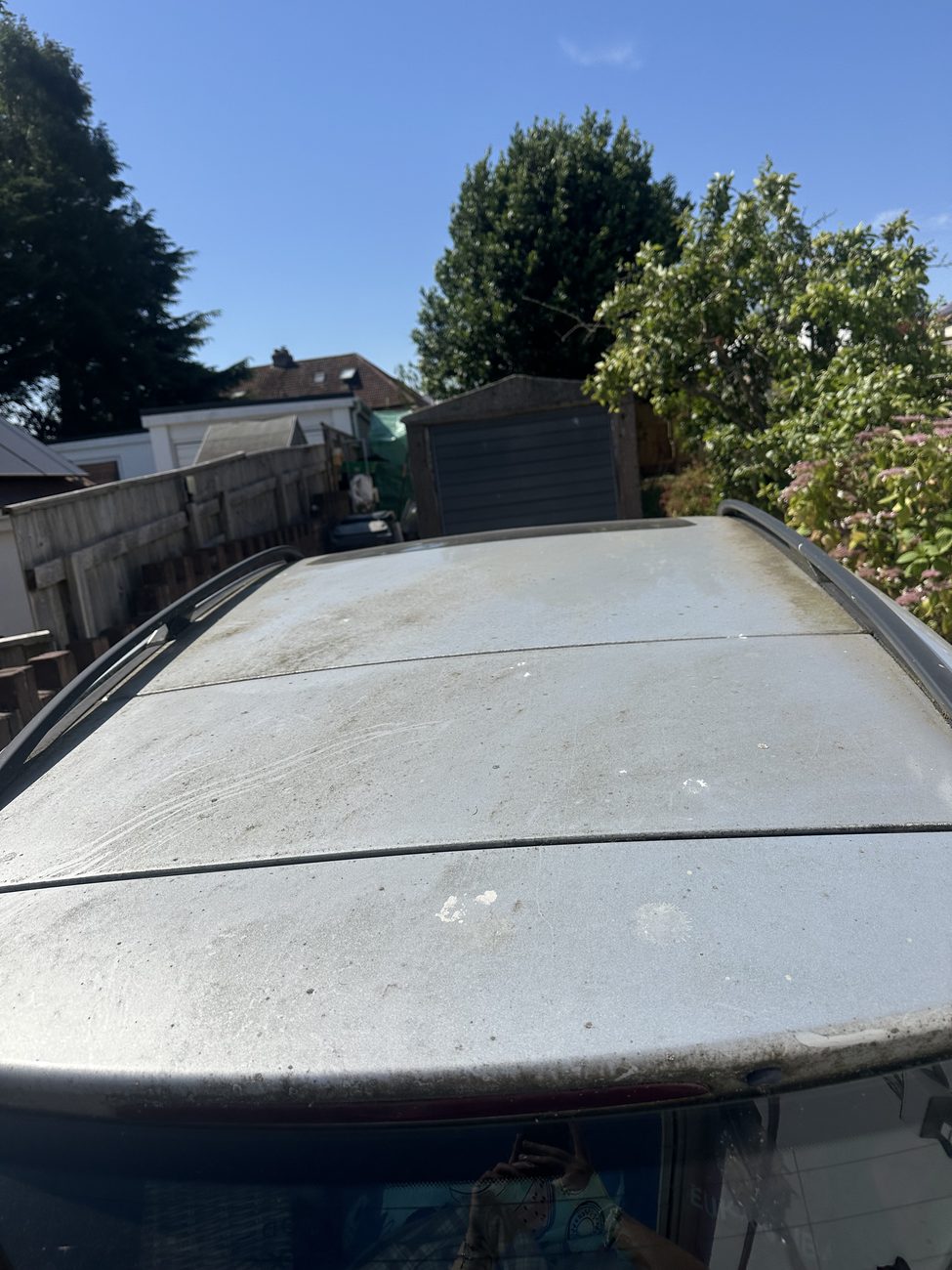 Mercedes SUV roof dusty and dull before cleaning