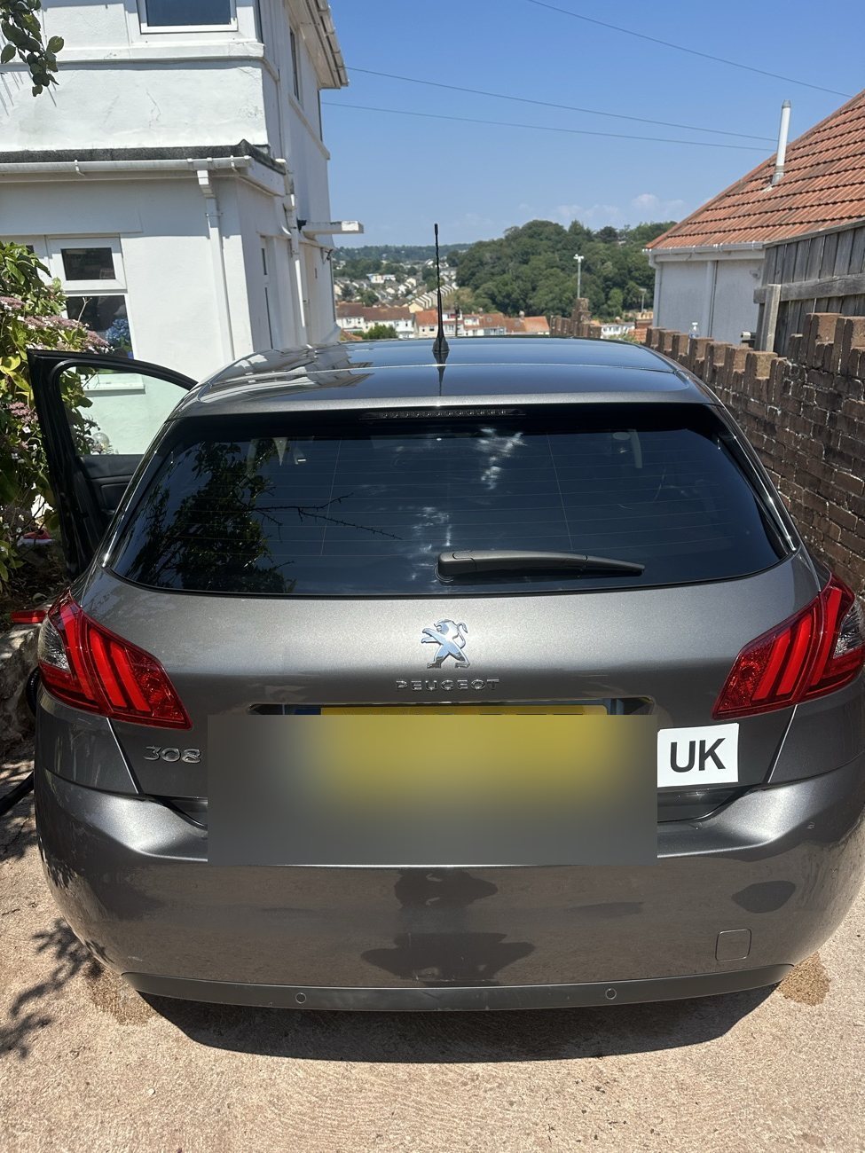 Grey Peugeot 308 rear after a full exterior detail